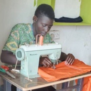 Man at sewing machine